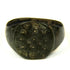 Roman bronze finger ring featuring irregular ring-and-dot decoration across the flat bezel