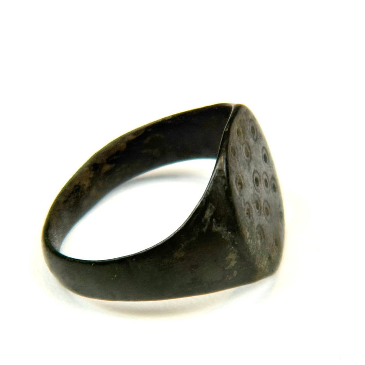 Ancient Roman ring with circular hoop, engraved geometric motifs, and naturally developed bronze patina