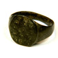 Bronze Roman ring with ring-and-dot engraving, weathered surface texture, and historic patination