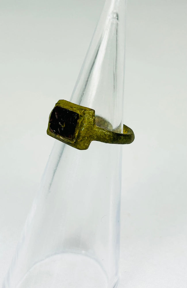 Authentic Roman bronze ring from 2nd century AD with fractured red glass intaglio