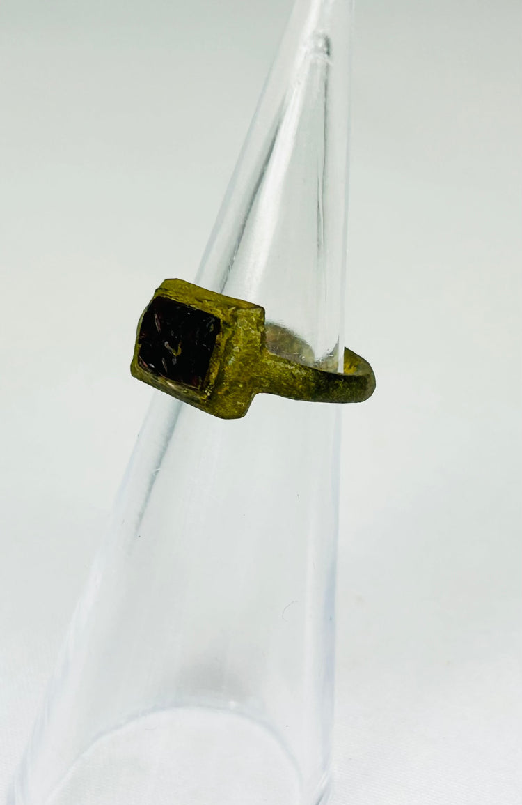 Authentic Roman bronze ring from 2nd century AD with fractured red glass intaglio
