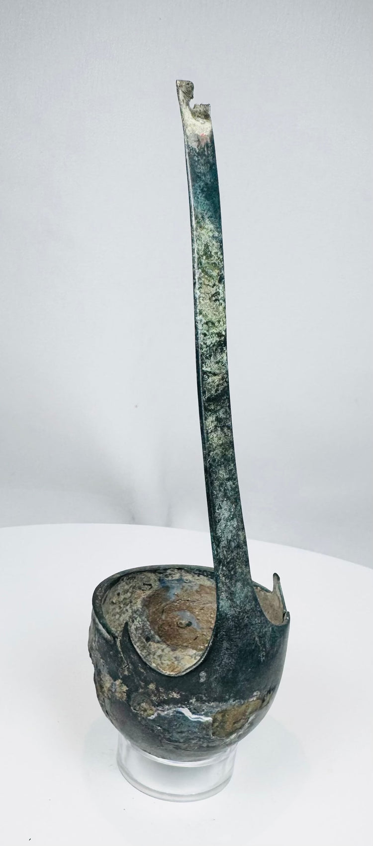 Front view of Roman bronze simpulum with triangular handle attachment