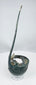 Ancient bronze utensil with two raised spur-like projections beside the handle