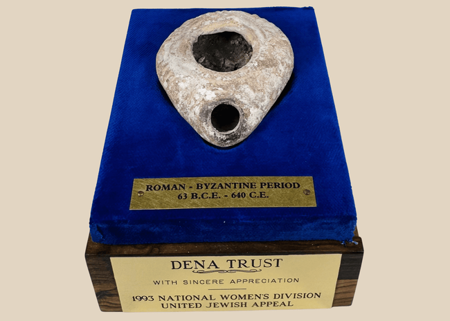 Ancient Roman–Byzantine terracotta oil lamp displayed in a custom presentation case