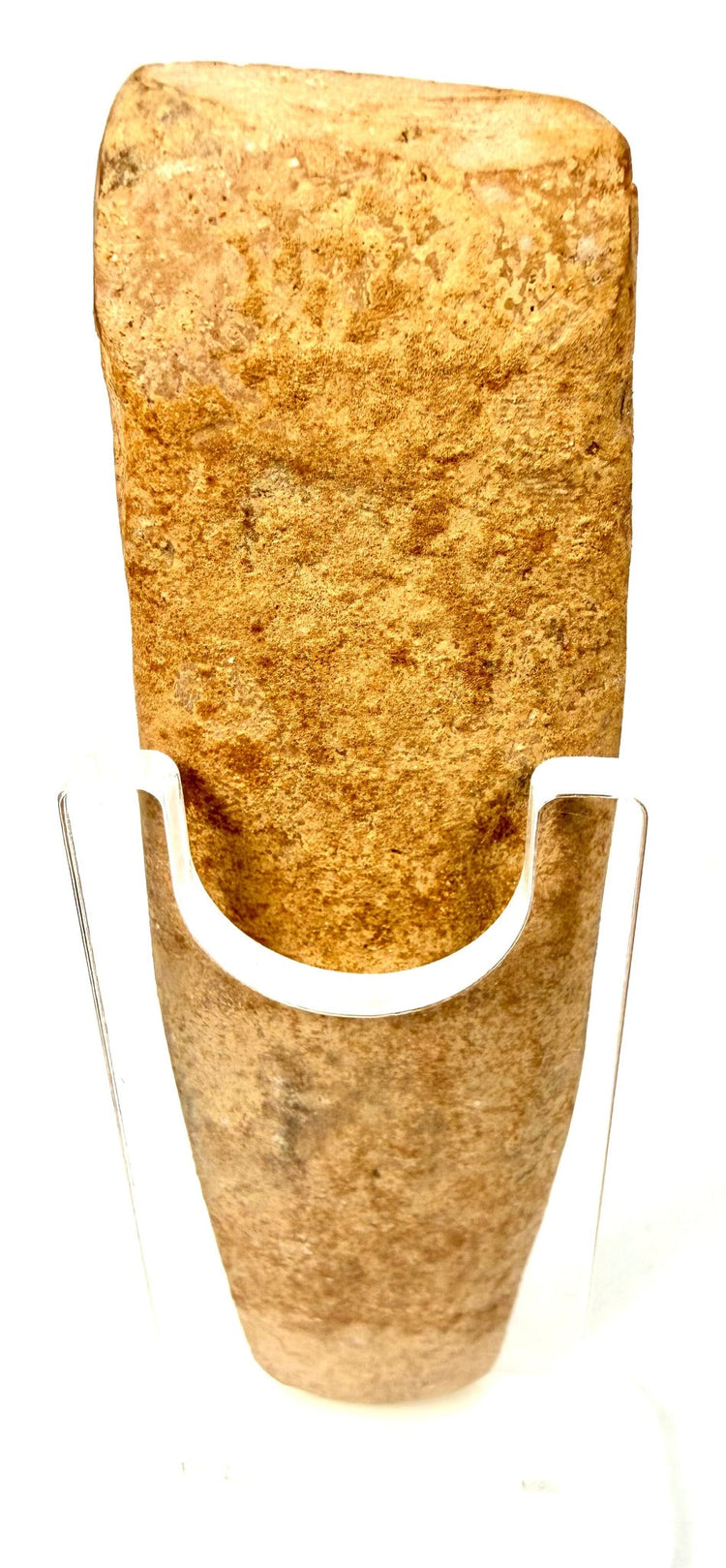 Rear view of ancient Roman terracotta fertility figure on acrylic stand