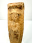 Roman Imperial terracotta votive figurine with faint facial features, an enshrouded body, and centuries of surface wear.