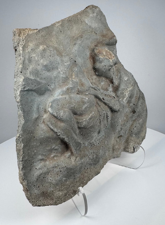 Ancient Roman volcanic stone carving with eroded figural composition, porous surface and mineral deposits