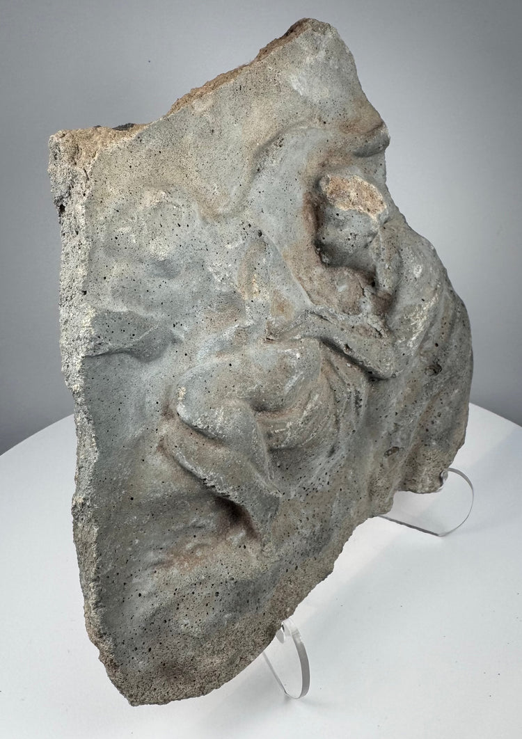 Ancient Roman figural stone fragment with weathered relief carving and gray volcanic tuff surface, circa 1st century BCE–2nd century CE