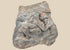 Ancient carved limestone relief fragment from the Mediterranean or Near East, Classical Period (circa 500 BCE–500 CE). Features two expressive human figures, likely part of a larger mythological or commemorative scene. Weathered surface and patina reflect centuries of age and Classical artistic traditions.
