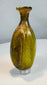 Ancient Roman olive green glass vessel used for perfumes, oils, cosmetics, or medicinal preparations