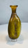 Authentic Roman Imperial glass flask featuring an olive green body and decorative vertical fluting