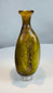 Authentic Roman Imperial glass flask featuring an olive green body and decorative vertical fluting