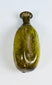 Ancient hand-blown Roman glass flask with fluted body and naturally weathered olive green surface