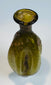 Roman Imperial period olive green glass container with distinctive vertically fluted design