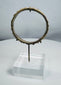 Ancient Mediterranean glass bracelet from the Roman Imperial period with archaeological deposits.