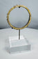 Archaeological Roman glass bracelet with raised nodules and naturally developed surface iridescence.