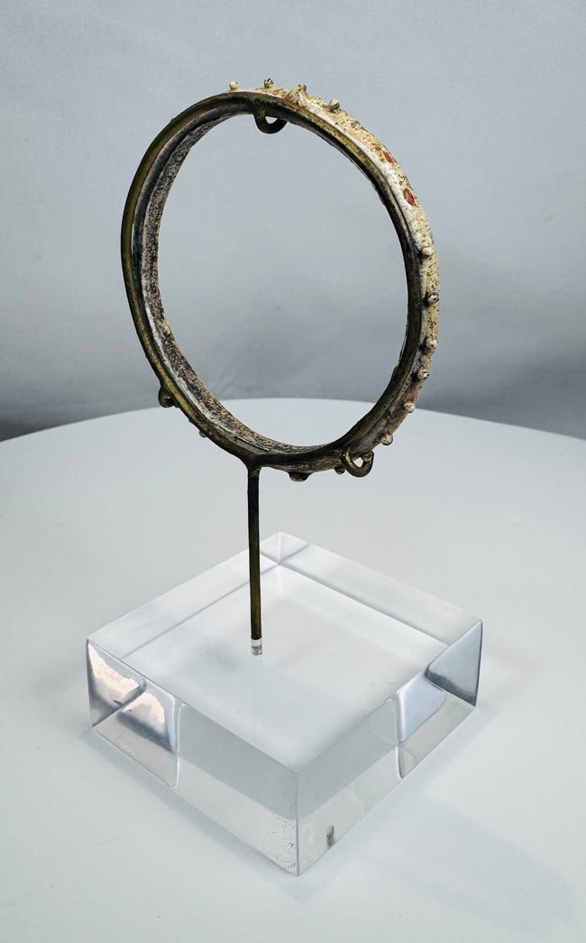 Roman Empire glass bracelet featuring circular form and applied nodular decoration.