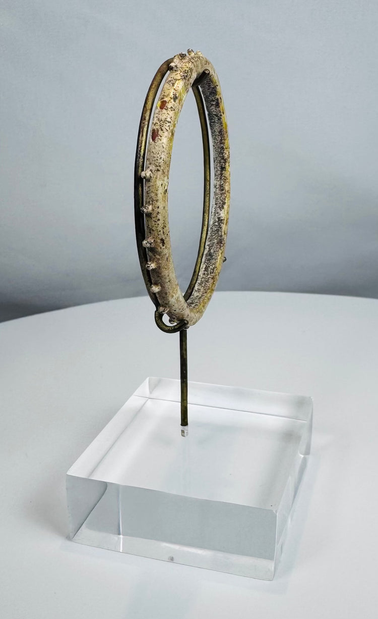 Collector-grade Roman glass bracelet showing attractive iridescence and mineral accretions.
