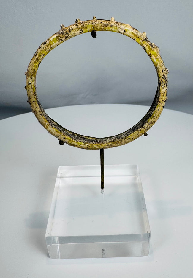 Authentic Roman glass bracelet featuring raised nodular ornamentation and archaeological patina.