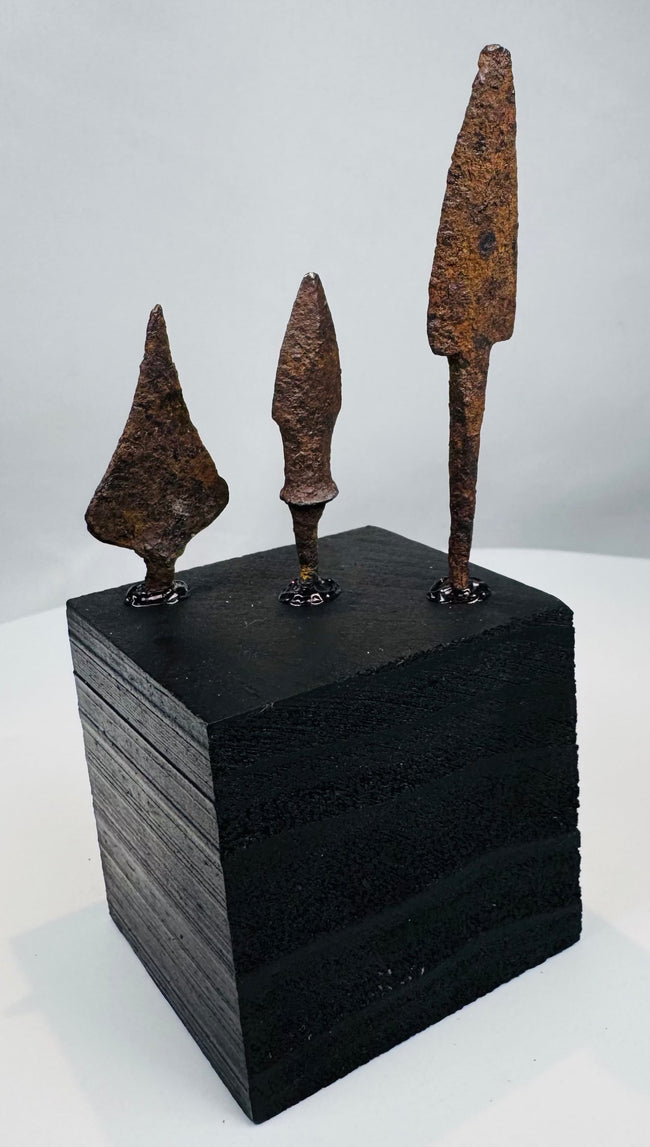 Roman-period iron weapon points with brown and ochre burial patina