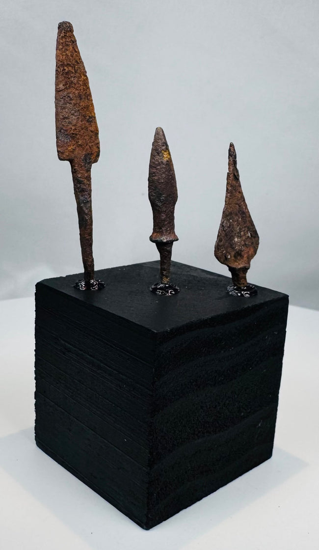 Side view of three archaeological iron arrow, javelin, or light spear points