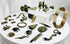 Ancient Roman bronze artifact collection featuring belt fittings, decorative appliqués, harness mounts, and a small spearhead from the Roman Imperial period