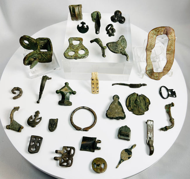 Authentic Roman bronze fragments and fittings with green patina including belt mounts, hinge plate, decorative mounts, and ancient military equipment components