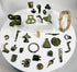 Authentic Roman bronze fragments and fittings with green patina including belt mounts, hinge plate, decorative mounts, and ancient military equipment components