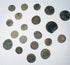 Mixed group of Roman Imperial and possible early Byzantine copper-alloy coins with worn portraits, inscriptions, and mineral encrustation.