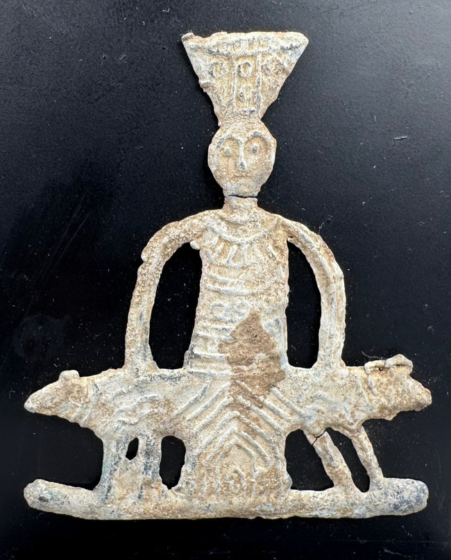 Roman Heliopolis votive figure mounted on a black wooden display stand