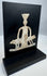 Ancient lead-alloy devotional plaque with ependytes garment and geometric pedestal motif