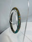 Multicolored Roman glass bracelet with fused glass bands and attractive archaeological weathering.