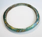 Ancient Roman bracelet displaying fused polychrome glass decoration and remarkable preservation.