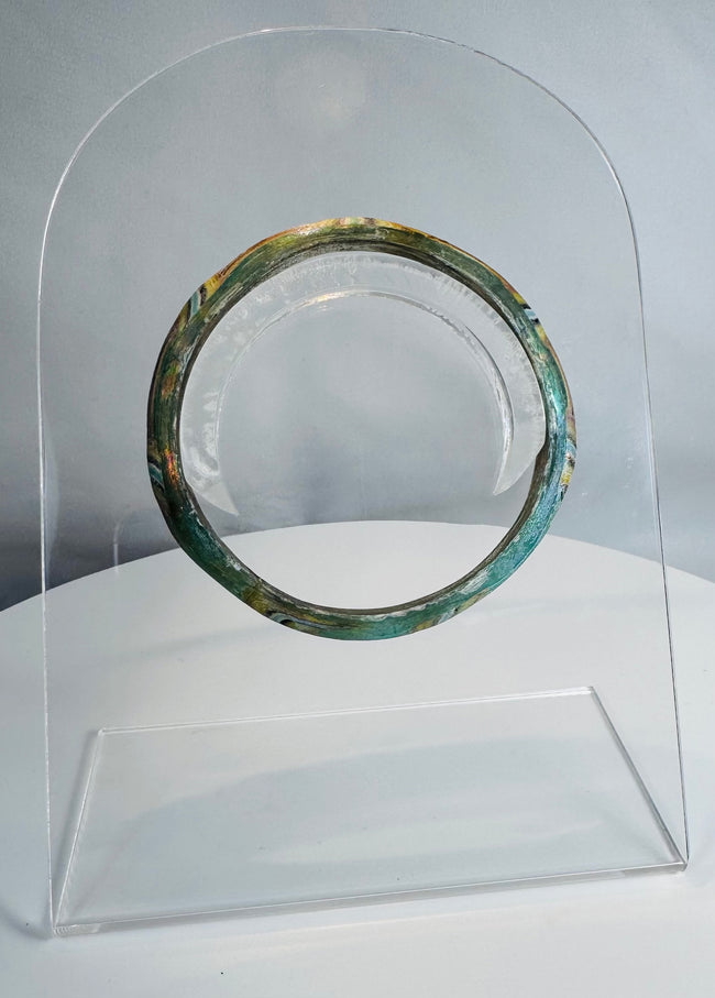 Roman Imperial mosaic glass bracelet preserved in a complete circular form with vibrant multicolored pattern.