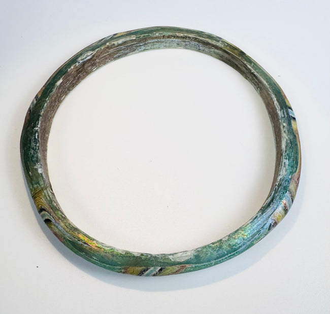 Collector-quality Roman mosaic glass bracelet with preserved multicolored design and archaeological character.