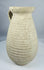 Ancient Roman terracotta pitcher from Africa Proconsularis with ribbed body and flared rim.