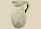 Ancient Roman North African terracotta pitcher from modern Tunisia with ribbed body and loop handle.