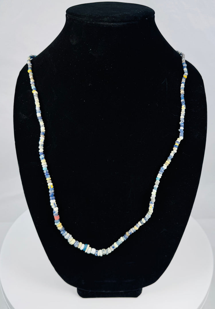Restrung Roman glass necklace with annular, barrel-shaped, and cylindrical beads