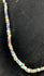 Roman Imperial glass beads displaying striped decoration and surface iridescence