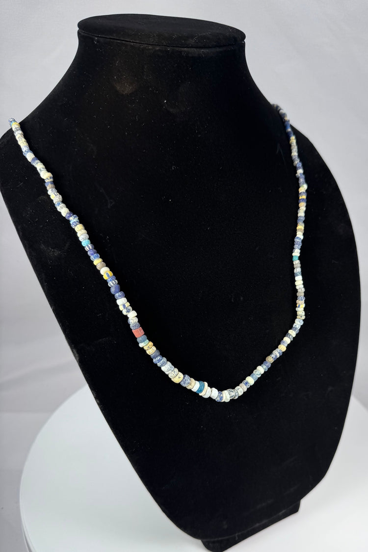 Ancient Mediterranean bead strand with cobalt blue, yellow, red, and white glass