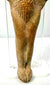 Ancient Roman terracotta fertility figurine detail showing stylized toes and incised shin lines