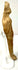 Side profile of beige terracotta figurine showing elongated form and convex back