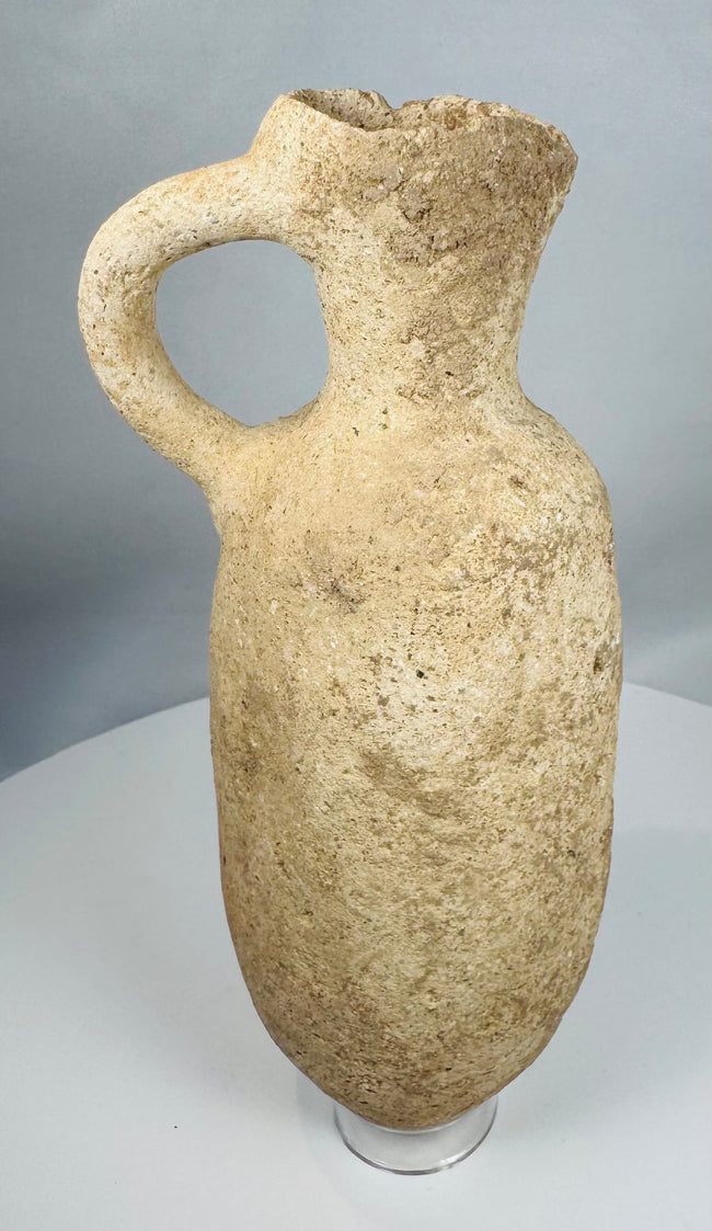 Authentic Roman terracotta storage vessel with a rounded body, loop handle, and weathered archaeological surface.