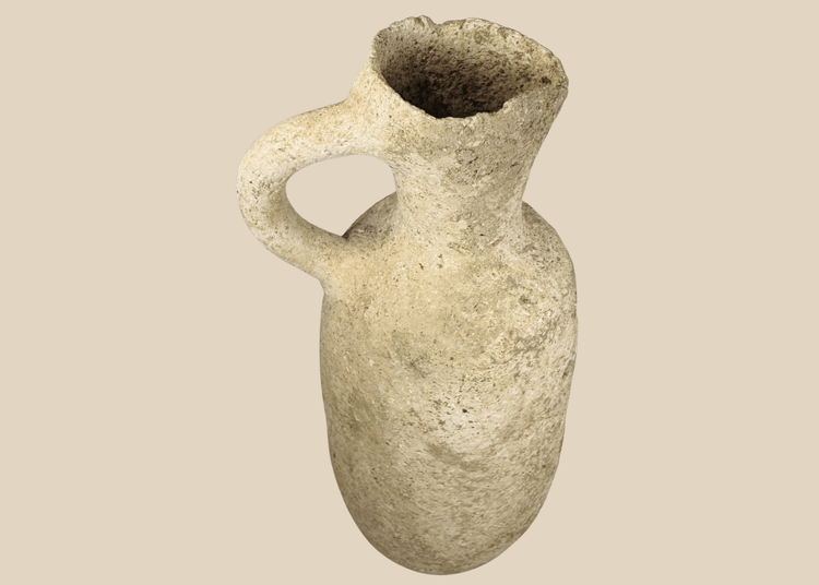 Authentic Roman Provincial terracotta pouring vessel dating to circa 100–500 CE with a globular body and loop handle.