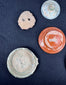 Roman terra sigillata fragments with maker’s stamp and incised ownership graffito