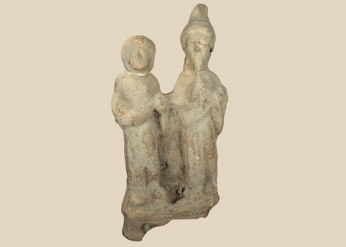 Ancient Greek terracotta votive figural group from Taormina, Sicily, depicting two standing human figures.