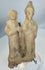 Ancient Sicilian terracotta votive figures with archaeological patina and integral molded base.
