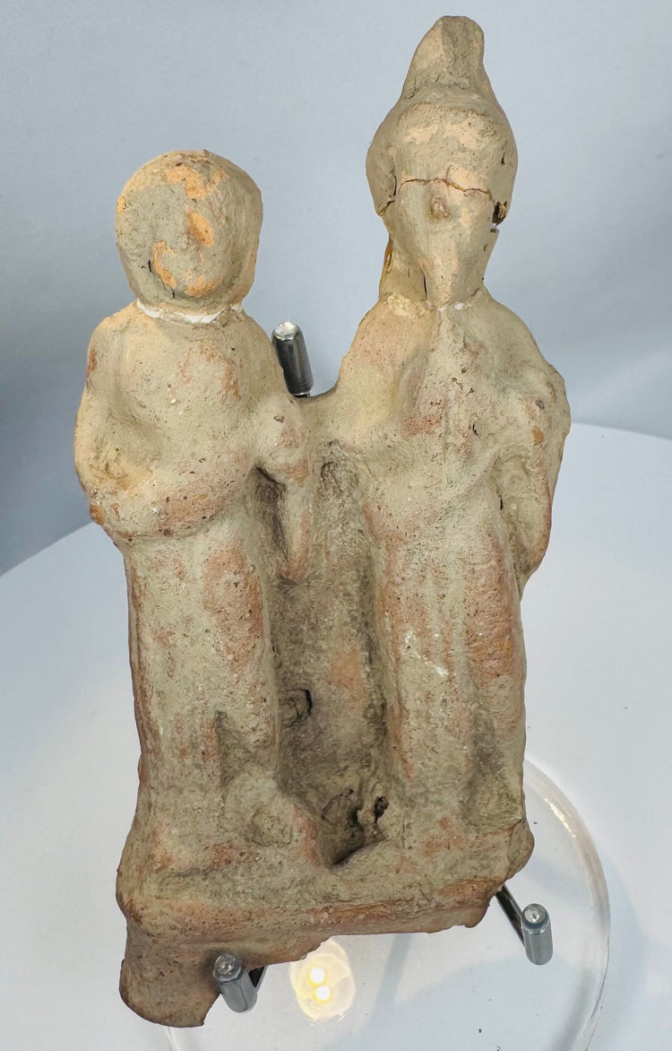 Ancient Sicilian terracotta votive figures with archaeological patina and integral molded base.