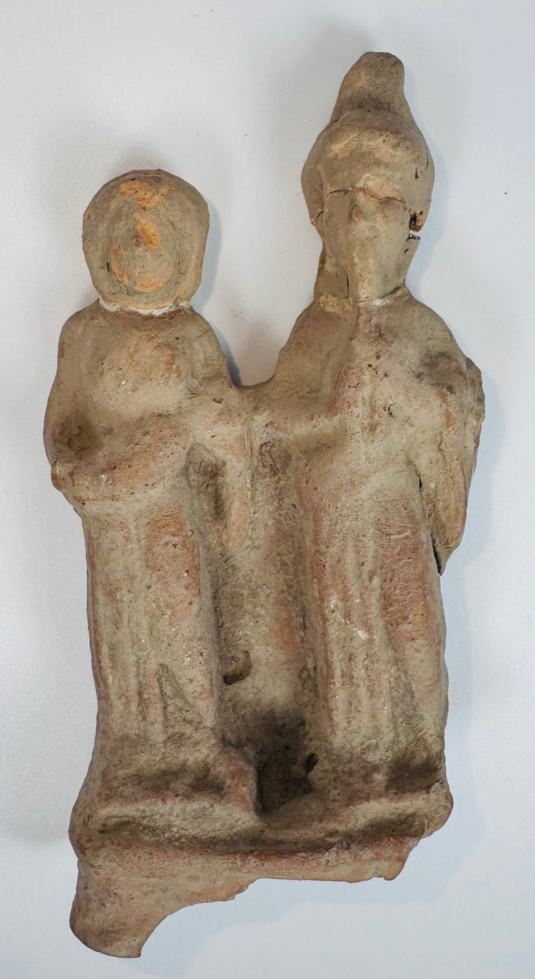 Authentic Magna Graecia terracotta sculpture featuring two stylized figures dating to the Greek Colonial Period.