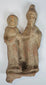 Authentic Magna Graecia terracotta sculpture featuring two stylized figures dating to the Greek Colonial Period.